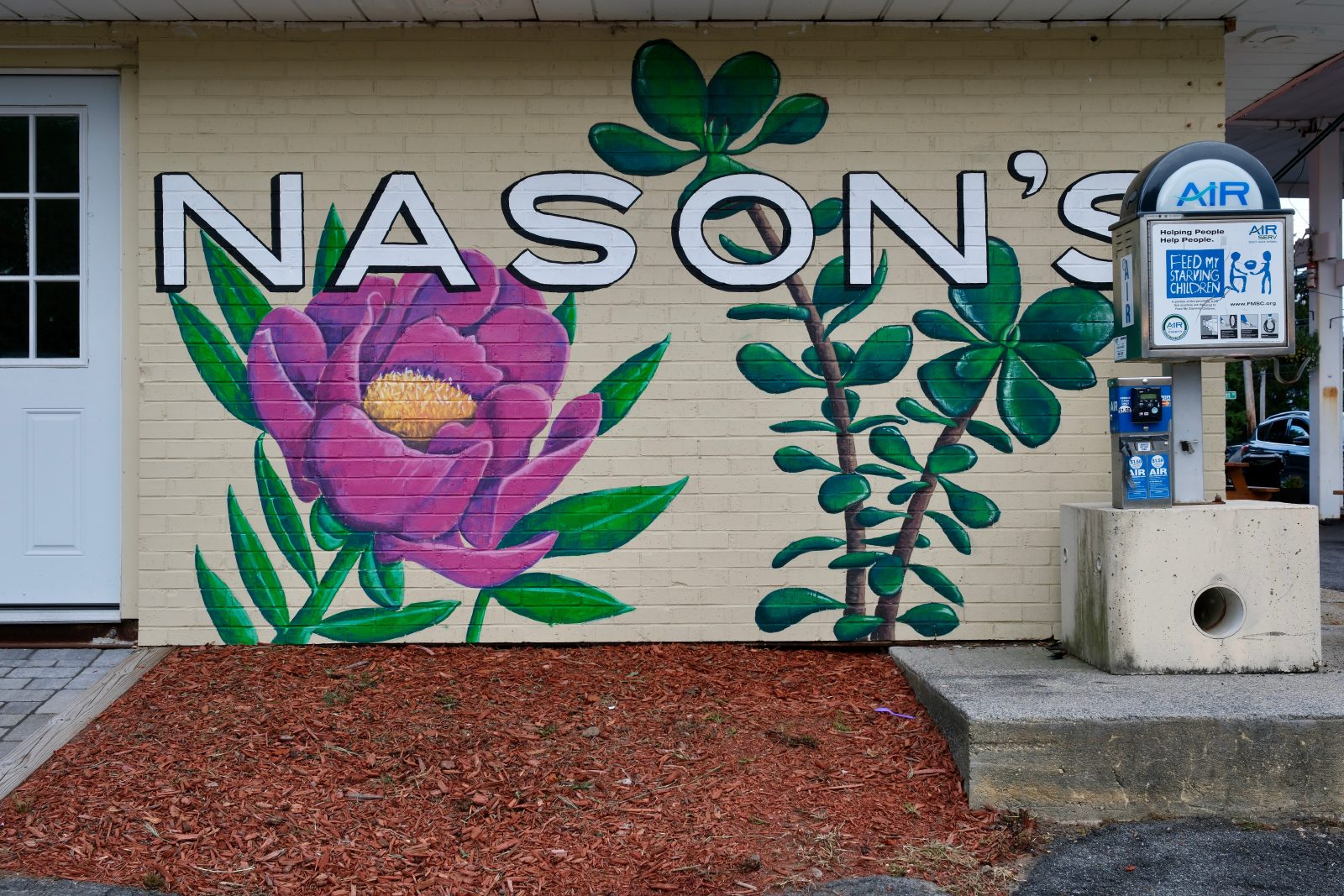Mural on brick on side of building saying Nason's